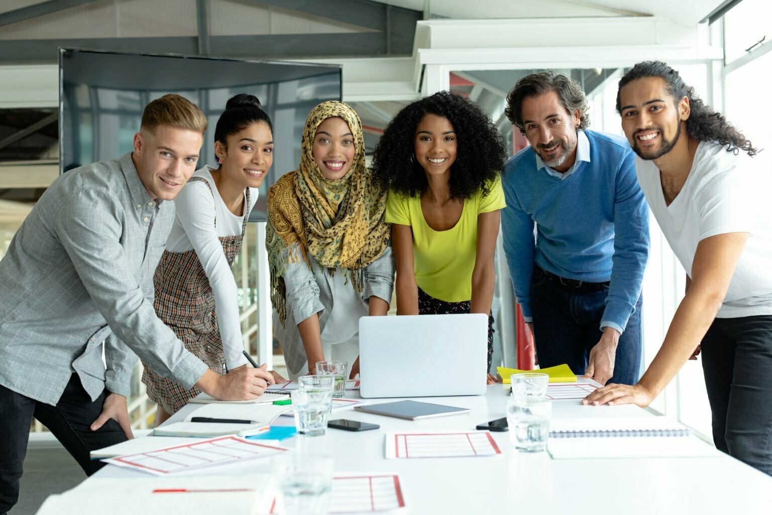 Front,View,Of,Diverse,Business,People,Looking,At,Camera,While